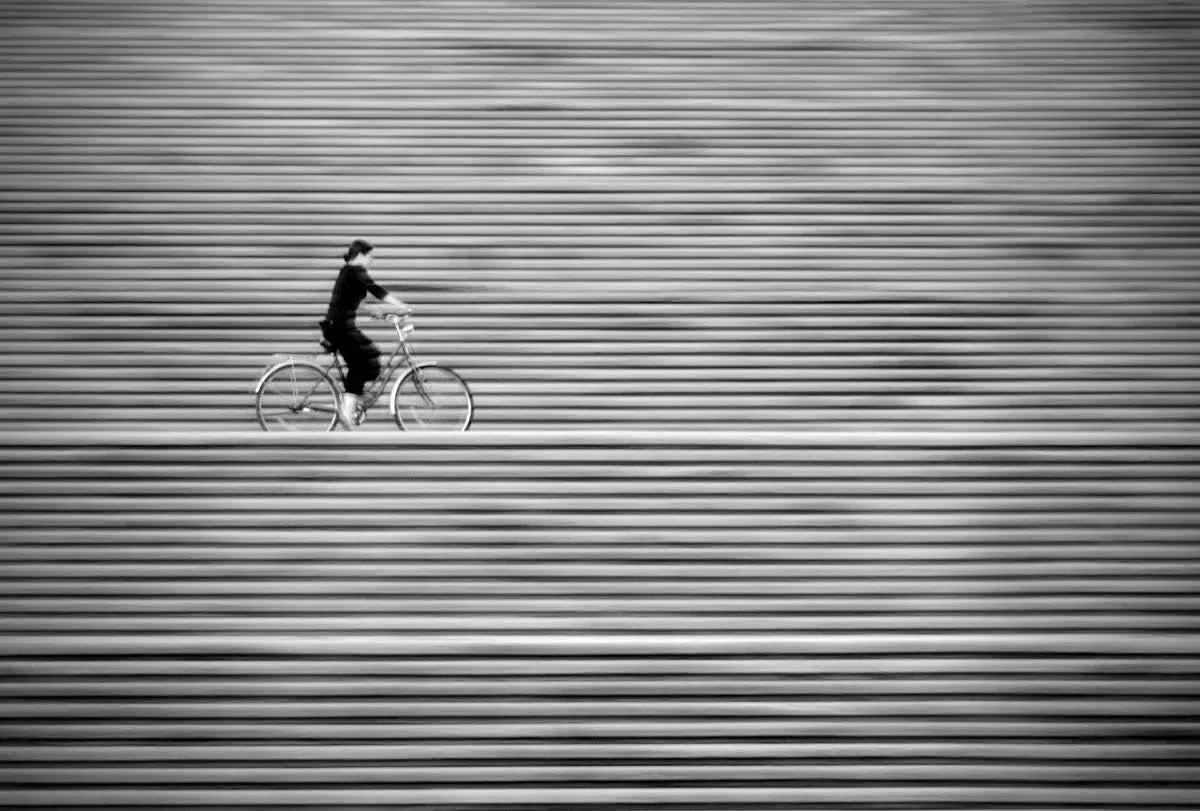 Girl on a bike, by Alex Axon-PurePhoto