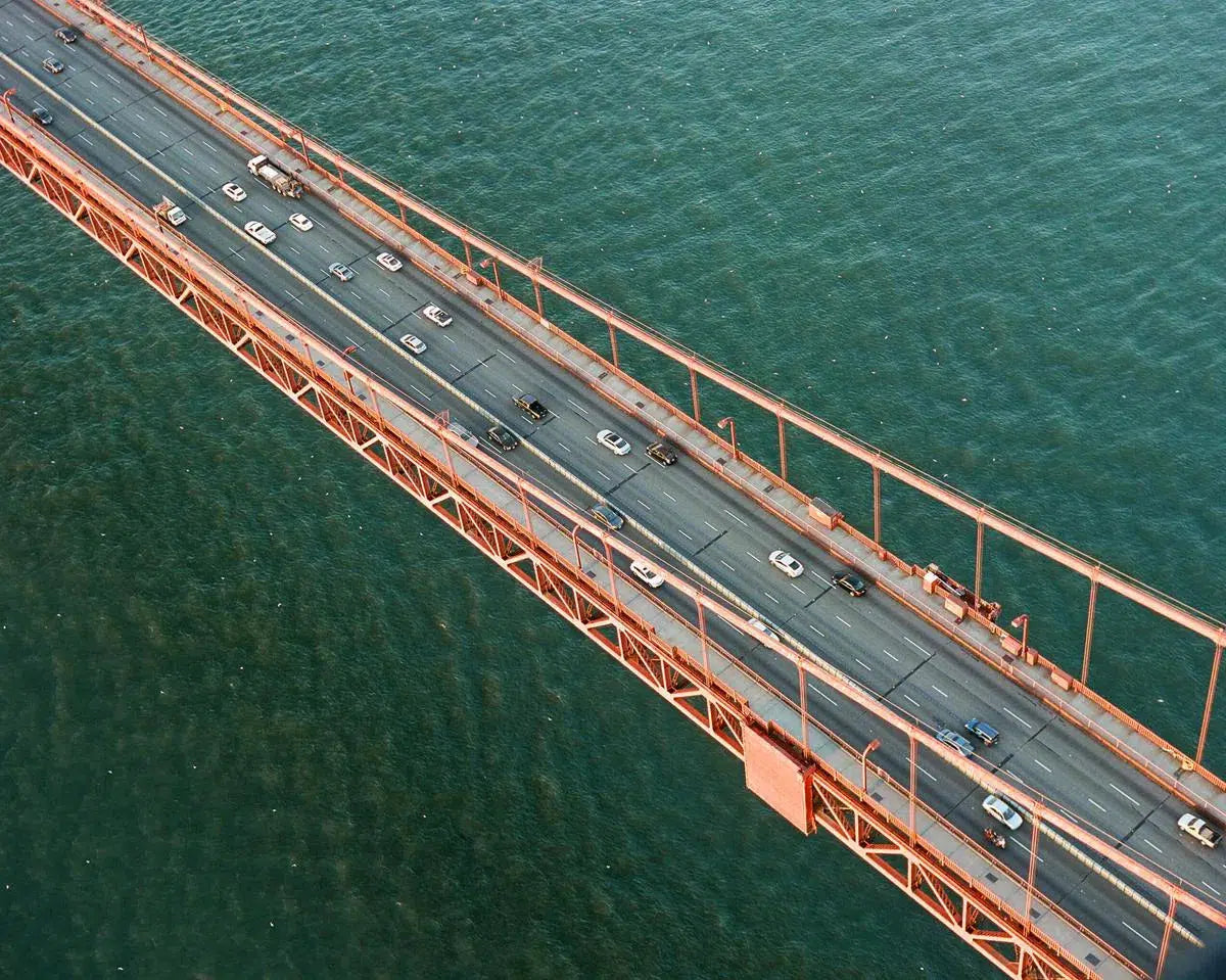 Golden Gate Bridge Traffic at sun rise, by Lauren Jonas-PurePhoto
