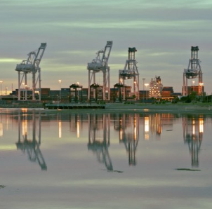 Oakland port cranes reflected at dusk, one of the Bay Area photographs in the program